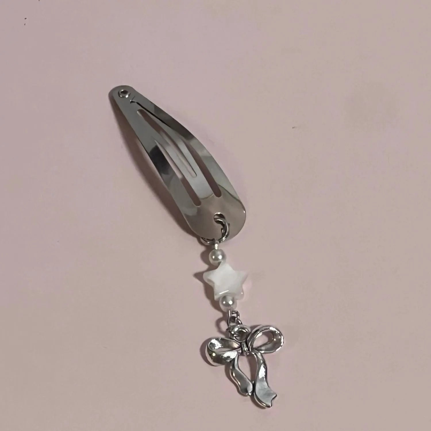 Silver star bow metal hair clip with electroplated finish, single pack