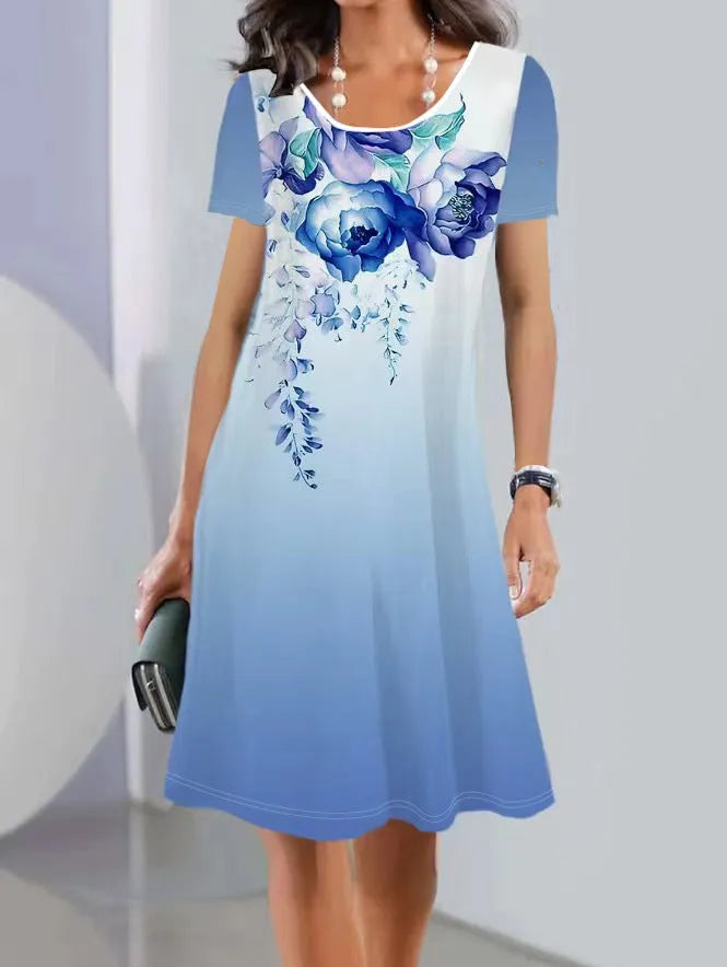 Printed mid-length summer dress with plants and flowers pattern, round neck and short sleeves