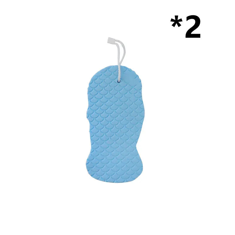3D fish scale pattern bath sponge ball in assorted colours on a bathroom background.