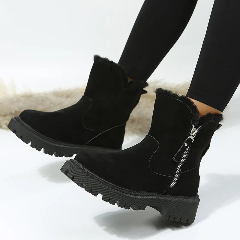 Women's black faux suede high-top snow boots with a side zipper and thick plush lining.