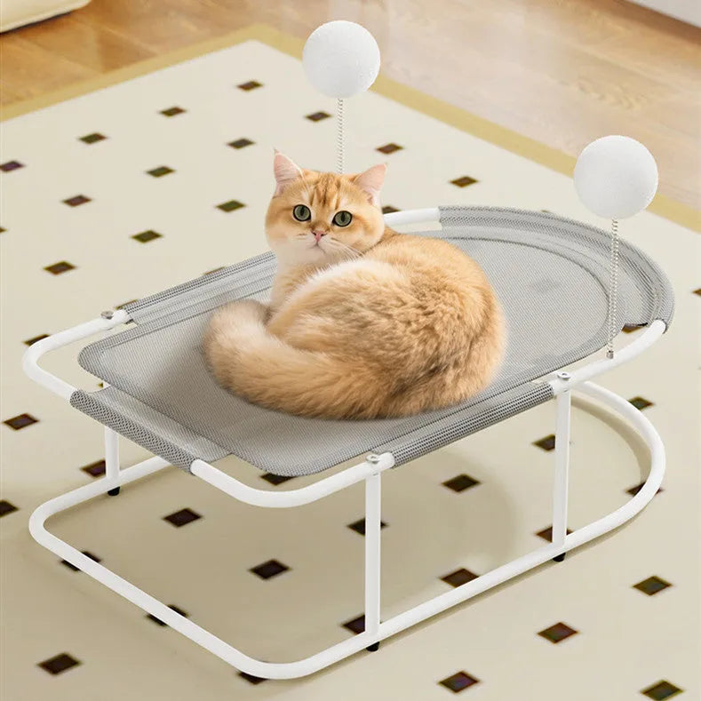 Large grey fabric kennel cage bed for a cat resting inside.