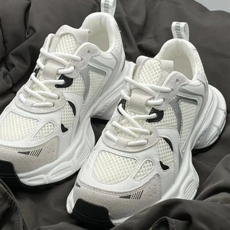 Beige mesh platform sports shoes with wedge heel and lace-up front on white background