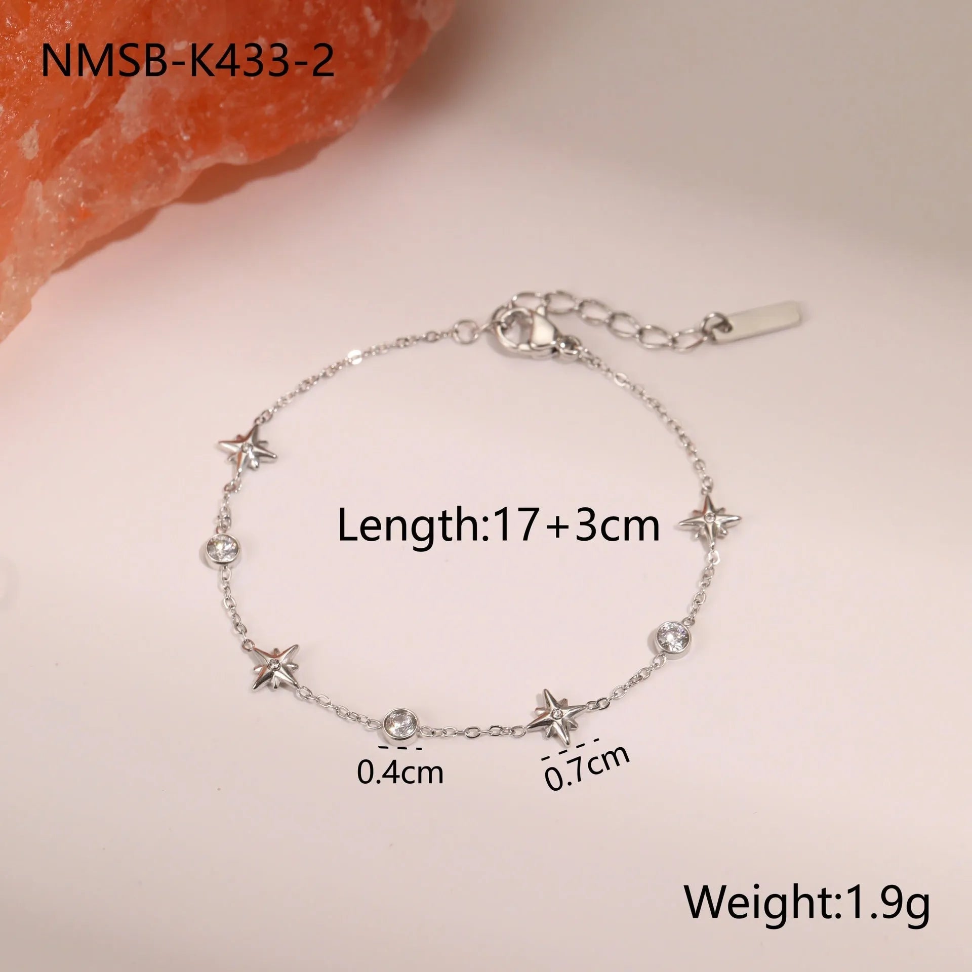 Ins women's gold-plated stainless steel bracelet with a geometric hexagonal star zircon pendant.
