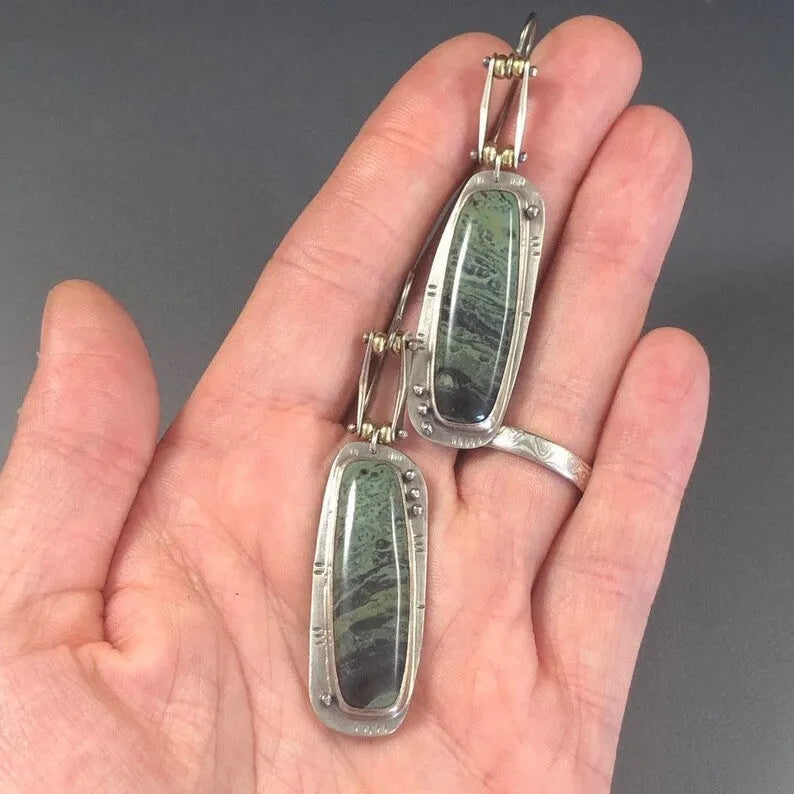 Women's geometric drop earrings with a two-colour marble pattern on alloy metal.