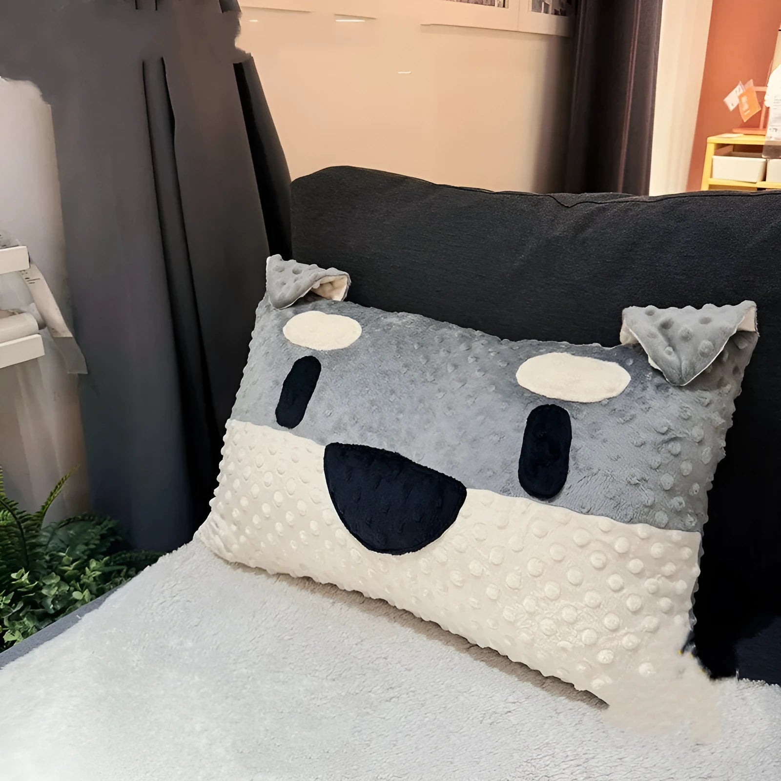 Grey and white West Highland puppy design dog pillow on a sofa, showing soft fabric and 50cm size.