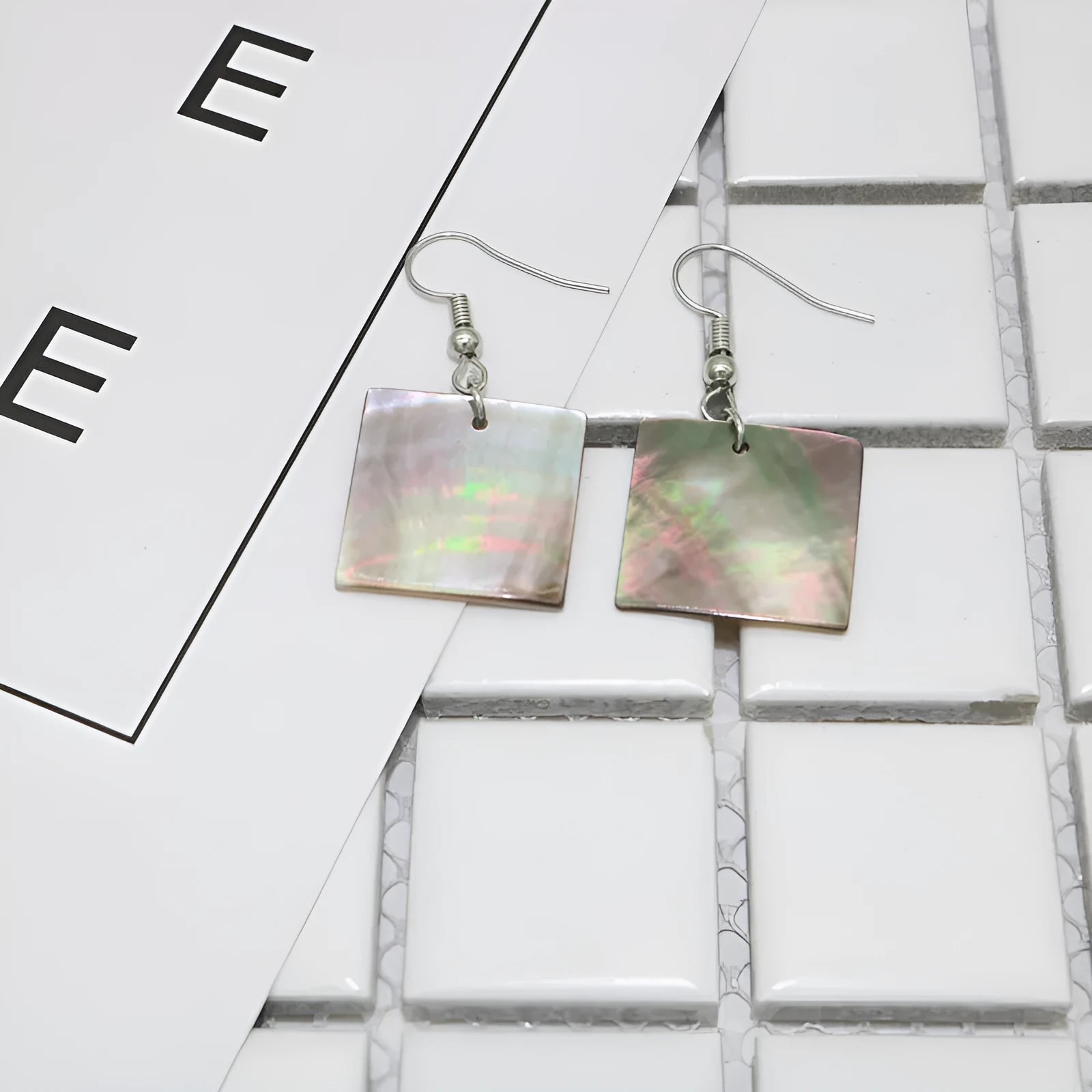 Geometric drop earrings made from natural shell in Square Panther or Rectangular Shell colour options.
