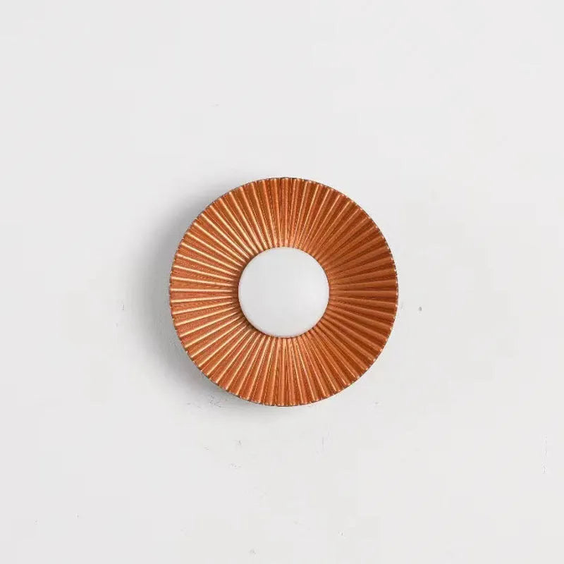 Round aluminium wall lamp with LED lighting in multiple colour variations including gold and white combinations