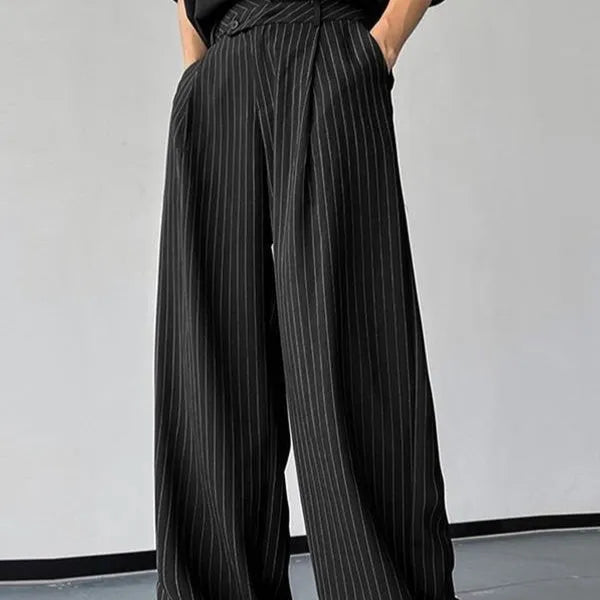 Black men's trousers with vertical striped pleated design showing elastic casual wear