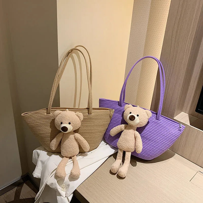 Cotton linen woven bag in dumpling shape with double shoulder straps and woven detailing