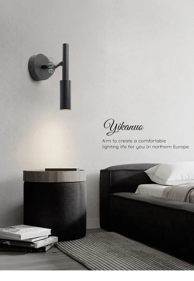 Black wrought iron modern wall light with three colour lighting options