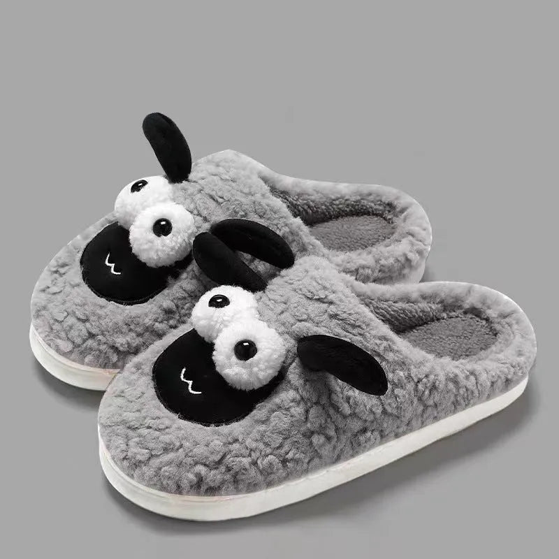 Brown, grey, and white suede slip-on slippers with a PVC sole on a plain background.