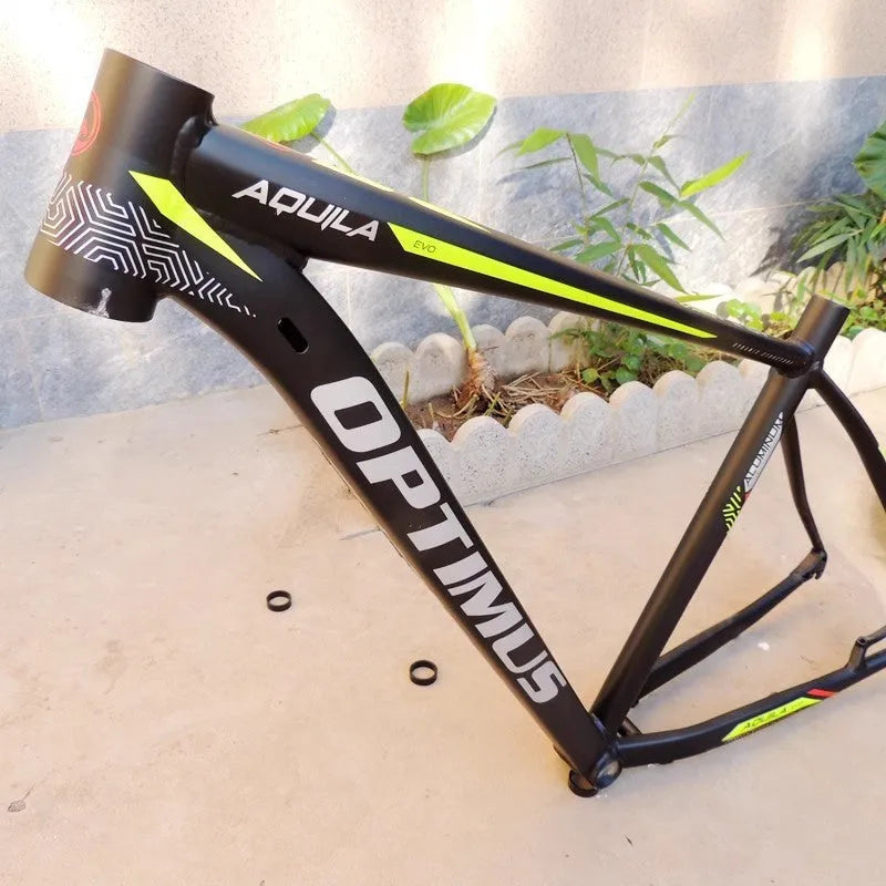 Black and green aluminium mountain bike frame with internal cable routing and disc brake mounts
