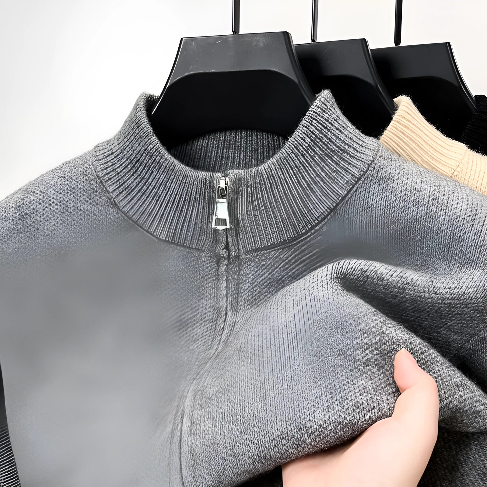 Men's black knitted zip-up cardigan with a stand collar and loose fit.