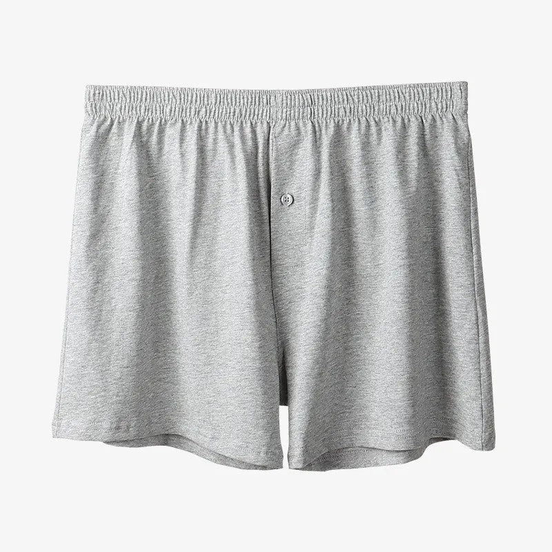 Men's black cotton loose boxer shorts with a high waist on a white background
