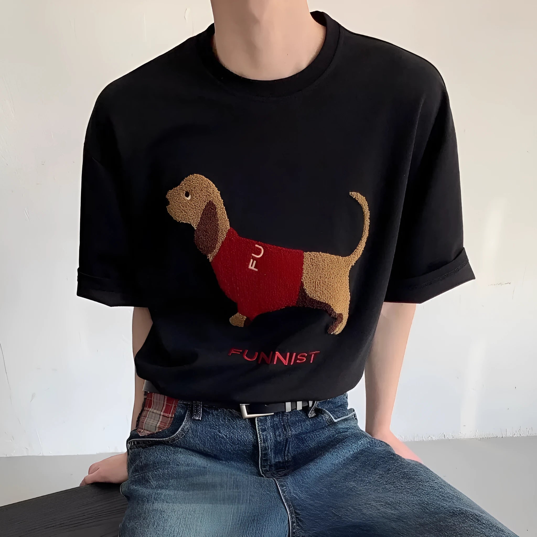 Men's grey cotton t-shirt with embroidered sausage dog and towel design showing round neck and short sleeves