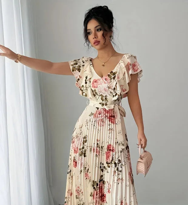 Apricot floral print dress with V-neck, ruffled short sleeves, and a high-waisted pleated swing skirt.