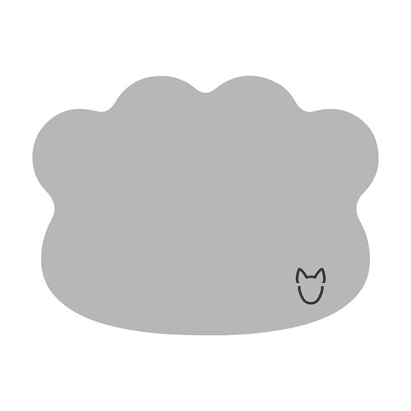 Light grey dog head shaped ice silk cooling mat for pets on a wooden floor.
