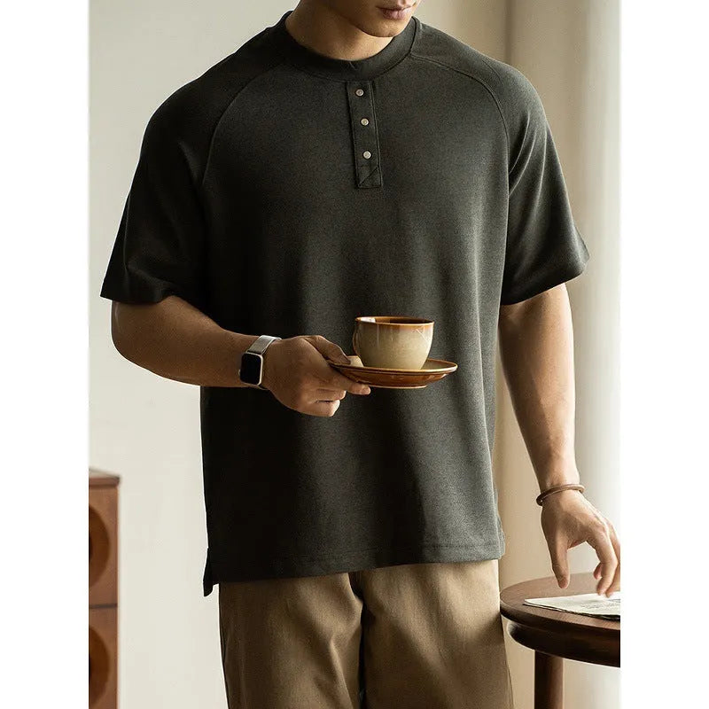 Casual loose-fitting pullover top with raglan sleeves in terry texture fabric shown in smoky grey colour