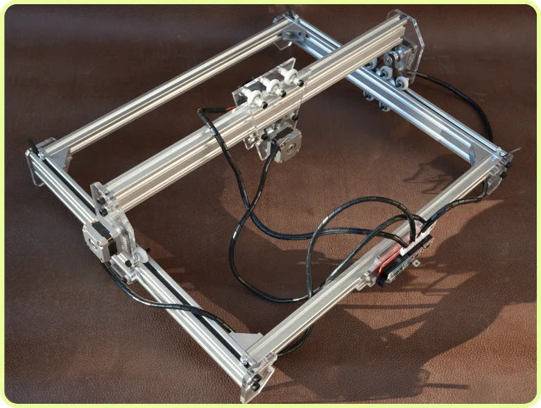 Miniature 3000mw laser engraving machine with a 400mm by 300mm base plate.