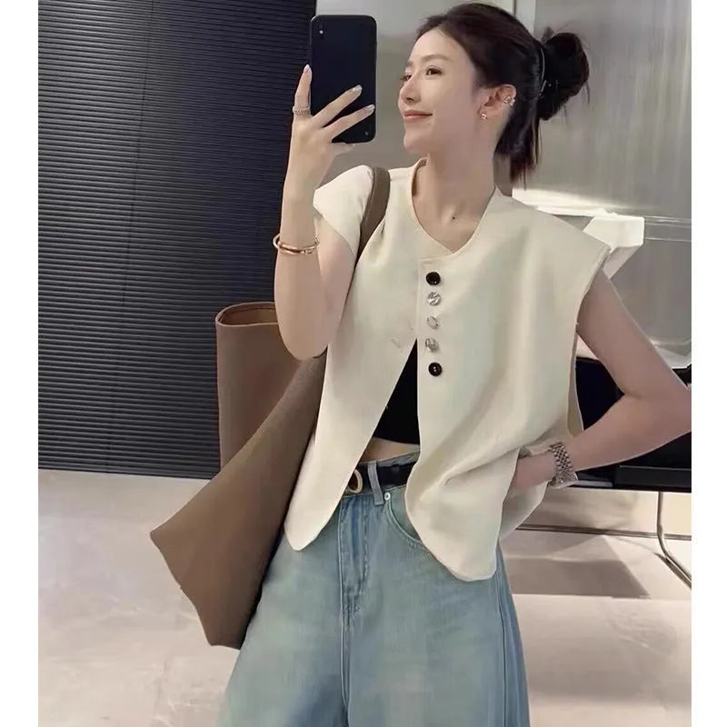 Women's loose-fitting solid colour polyester vest with a pocket, shown in milky white.