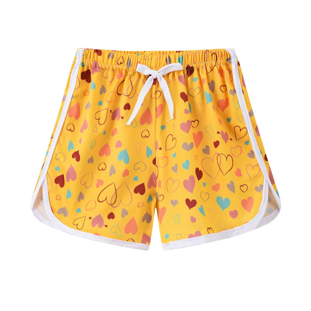 Children's colourful polyester beach shorts showing multiple pattern options with height-based size tags