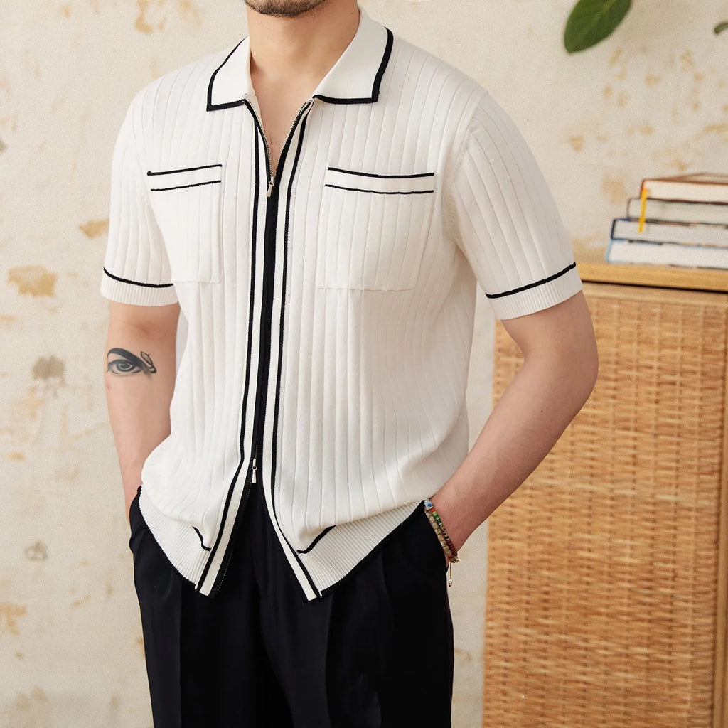 Slim fit lapel collar short-sleeved polo shirt in black, laid flat.