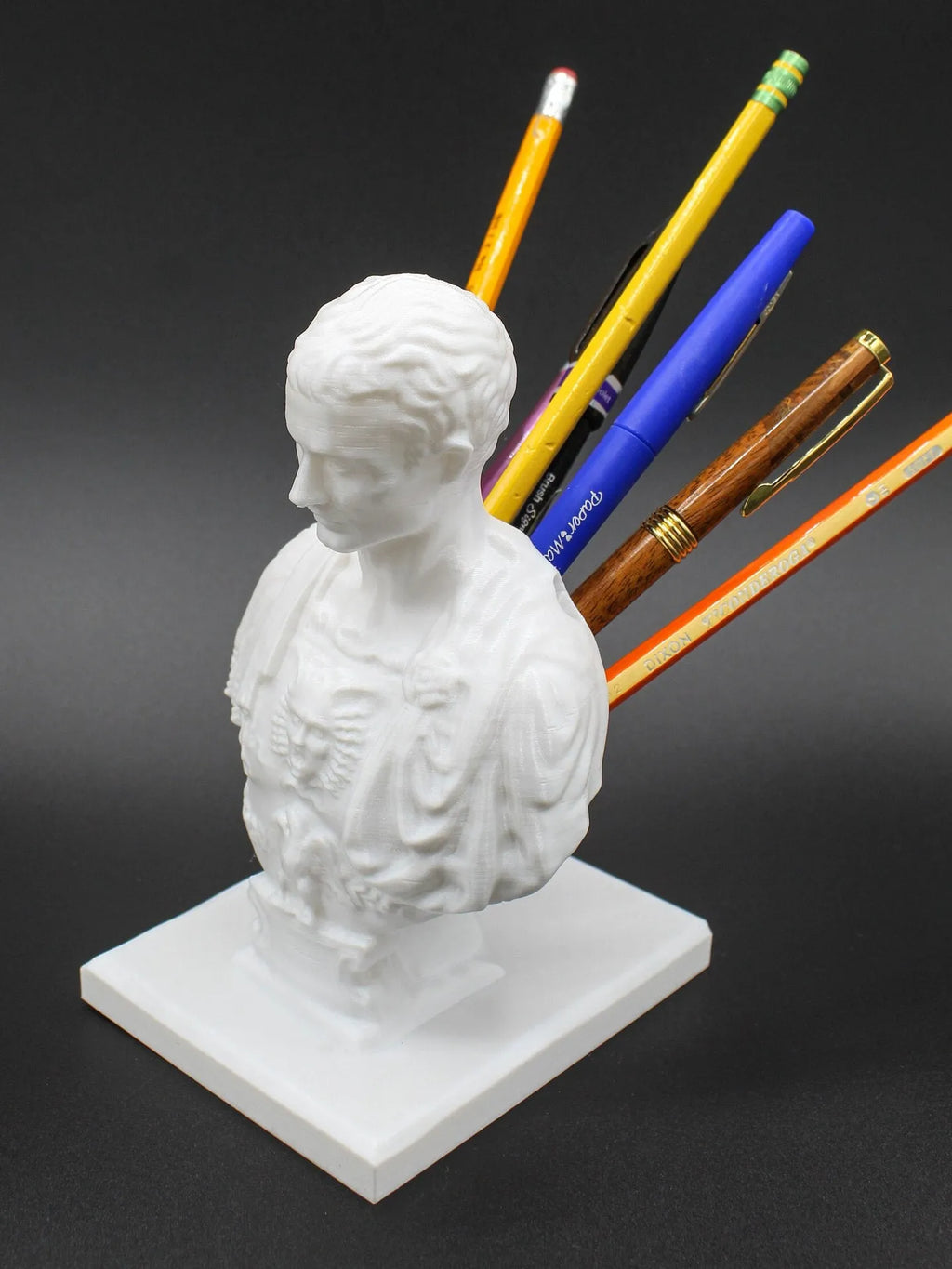 White synthetic resin pen holder with American creative character modelling design