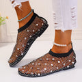 Colourful rhinestone detail on women's mesh flat sandals with round toe and rubber sole.