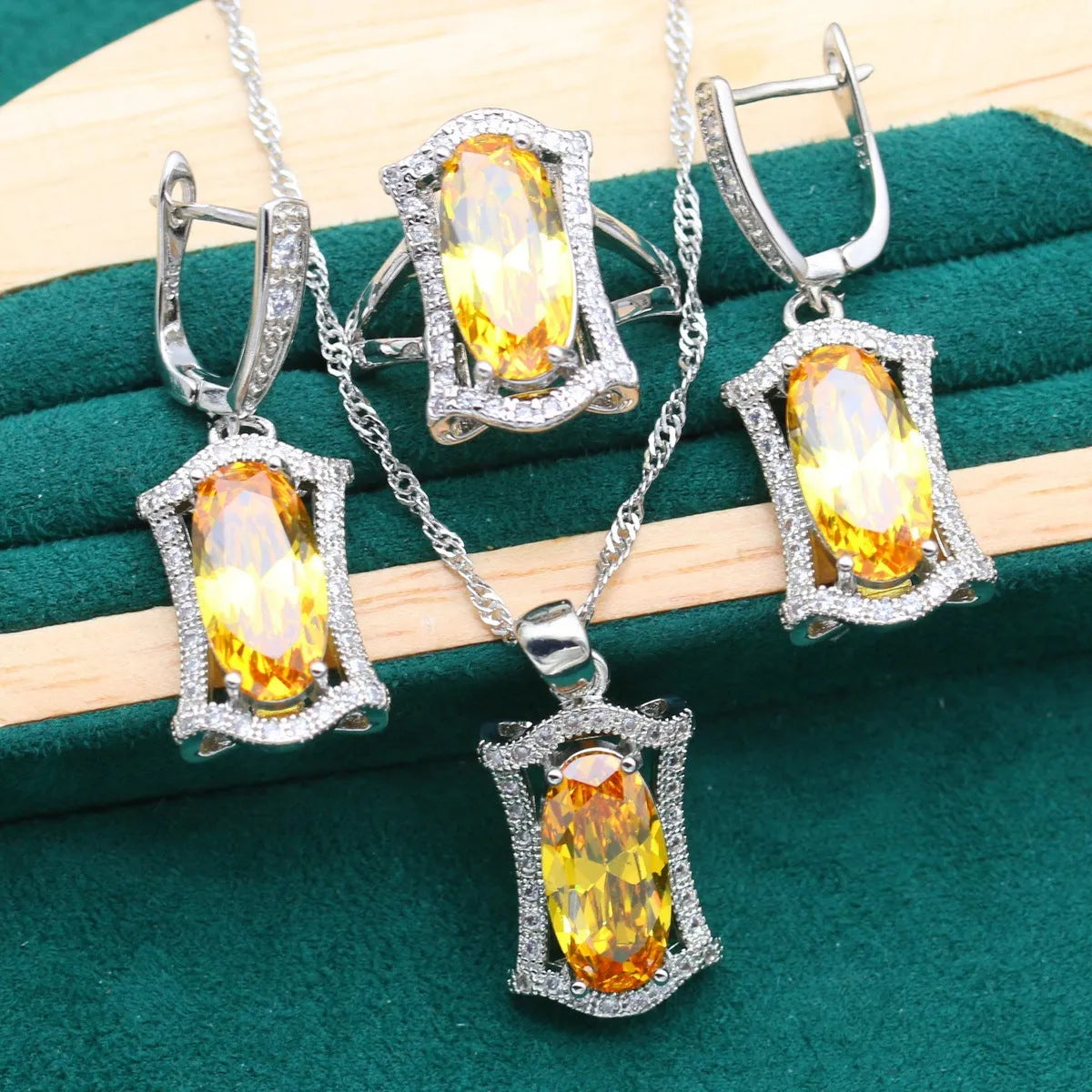 Anti-allergy zircon jewellery set with snake bone chain necklace, earrings, ring, and bracelet in yellow or olive.