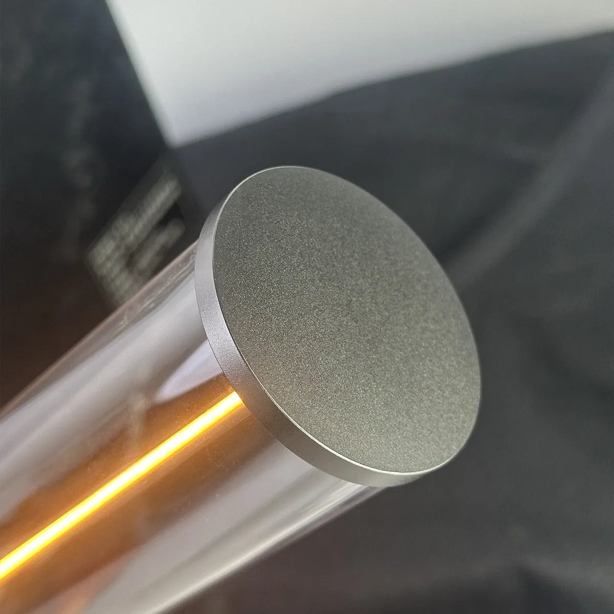 Slender white USB LED light strip with magnetic base on a metal surface