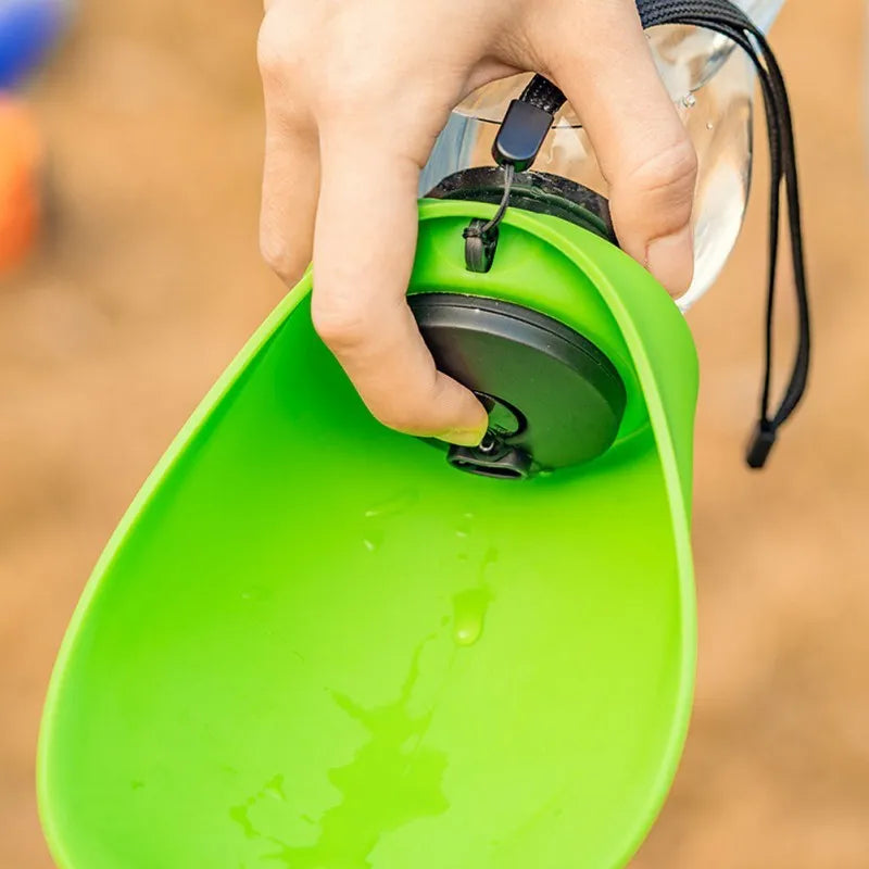 Portable blue dog water bottle with drinking bowl showing key lock mechanism and 680ml capacity markings