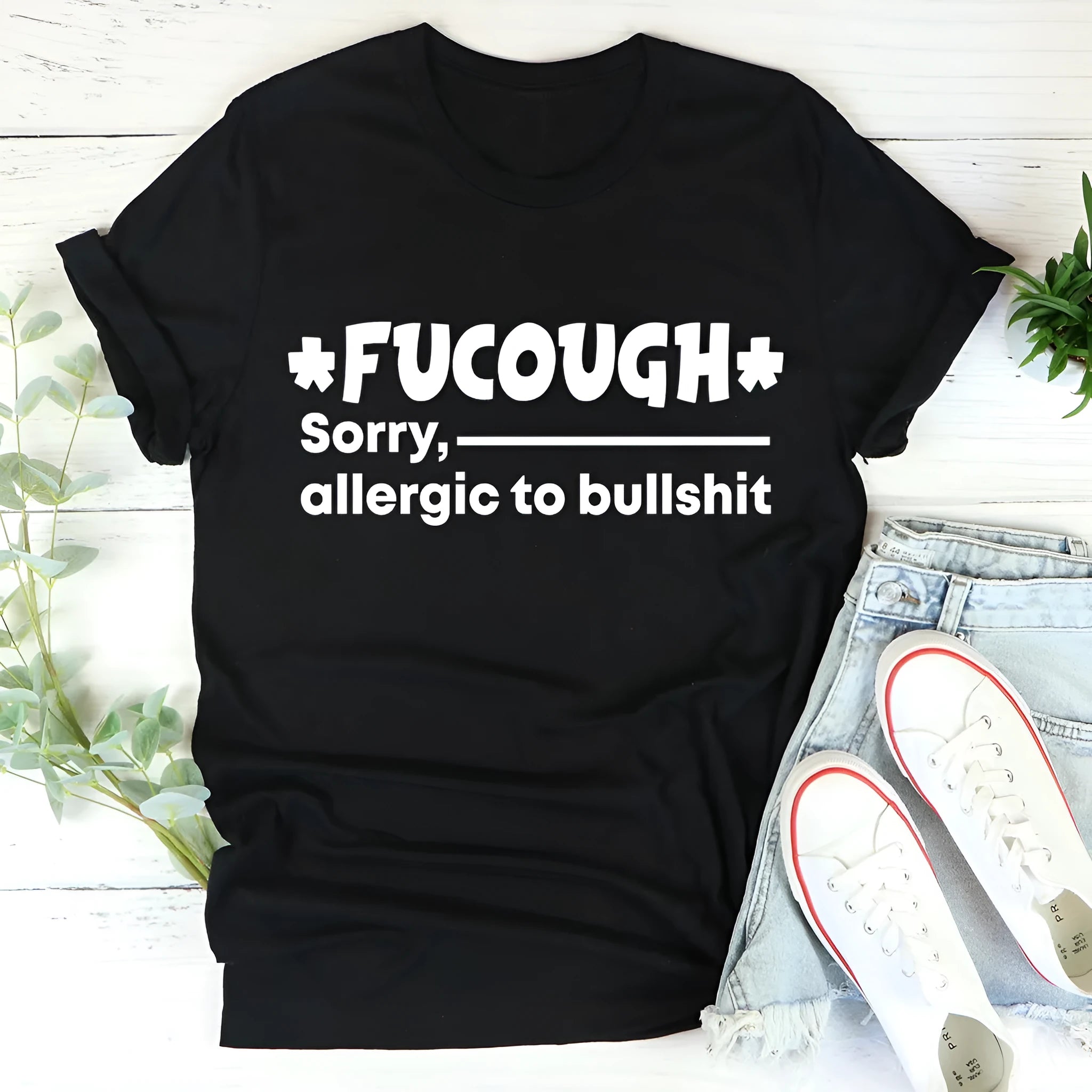 Black loose fit cotton T-shirt with round neck and short sleeves on hanger