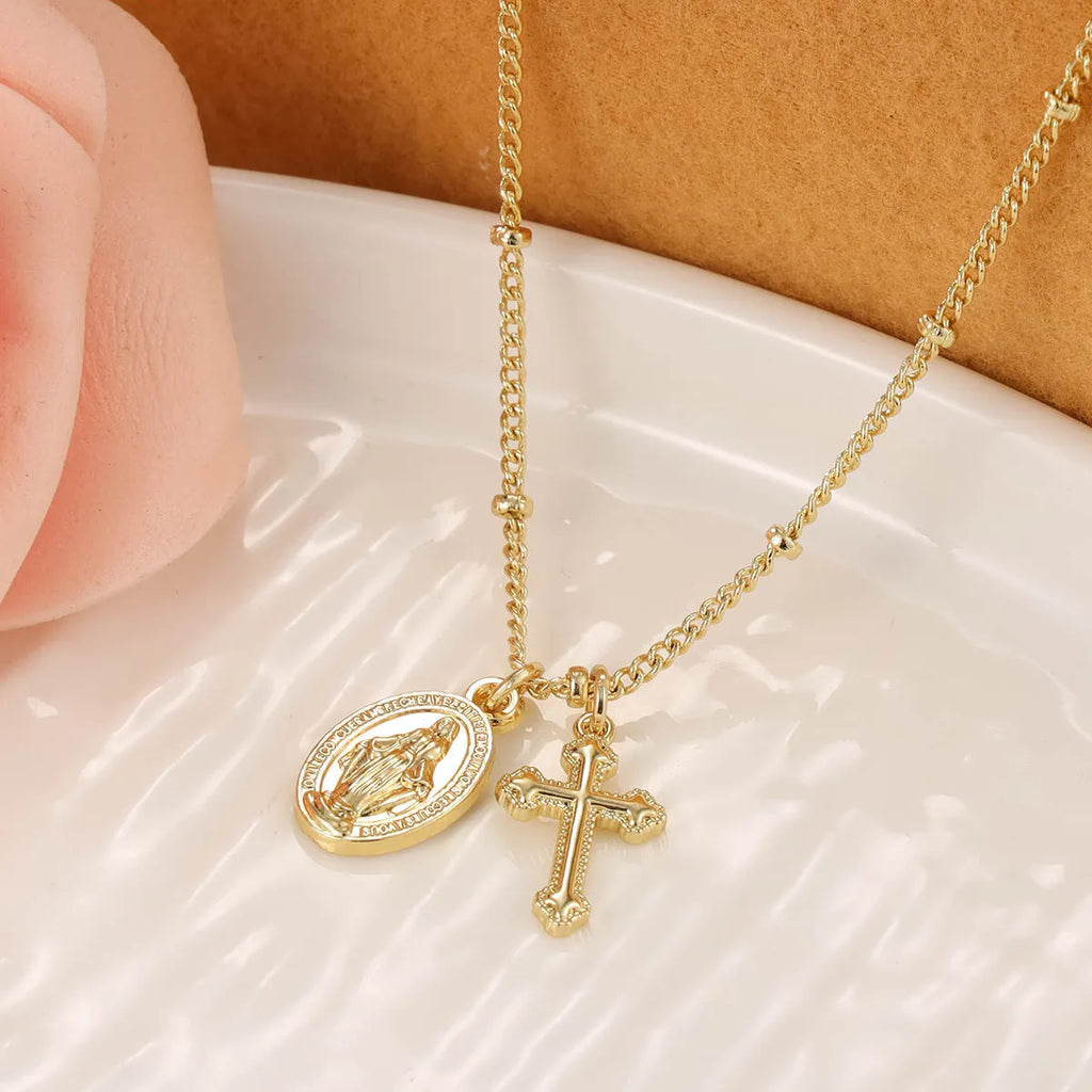 Gold Virgin Mary cross necklace with geometric pendant design for women