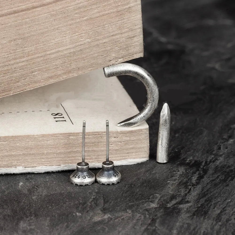 S925 sterling silver punk nail stud earrings showing straight and curved nail designs