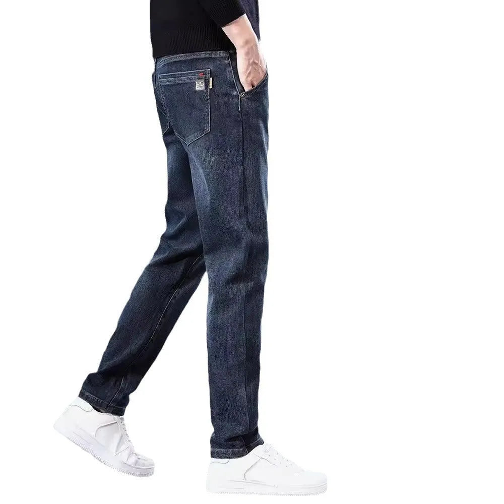 Blue grey slim straight leg casual trousers on a hanger, showing the mid-rise waist and zipper fly.