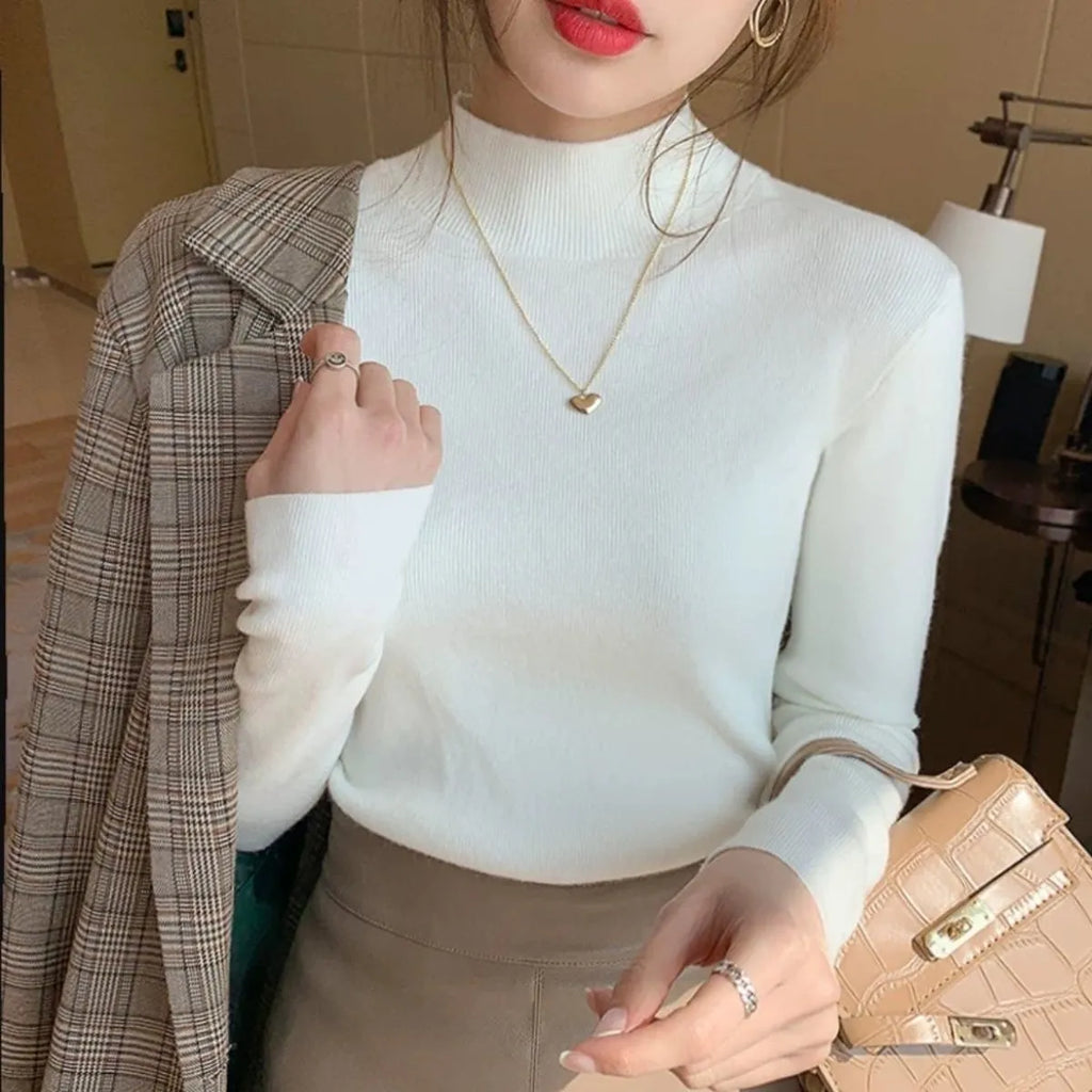 Slim fit long sleeve knitted shirt in viscose fibre shown in apricot colour.