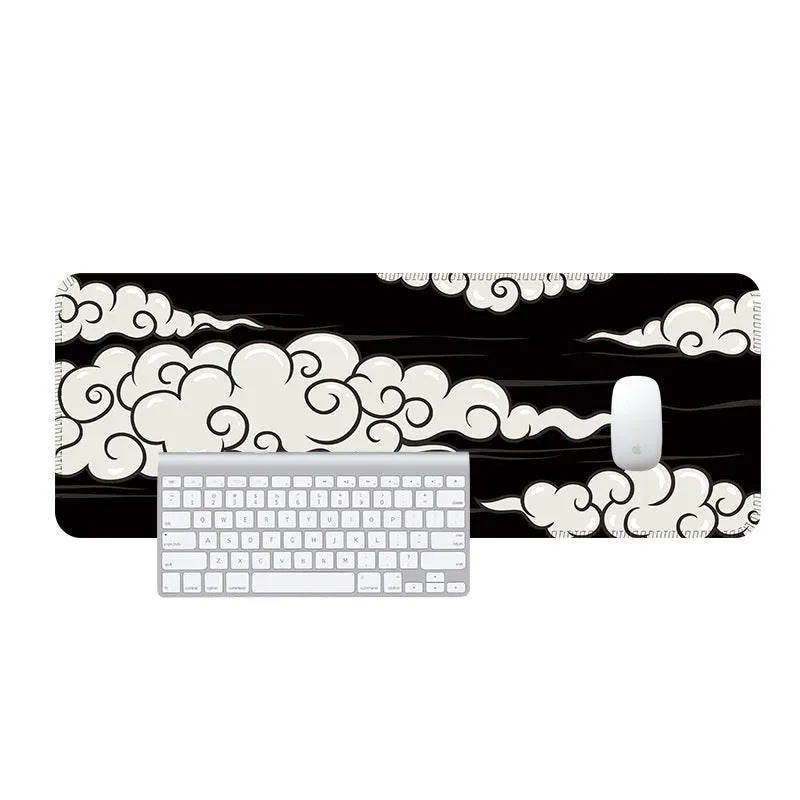 Large natural rubber cloud mouse pad and desk mat with non-slip base on wooden desk