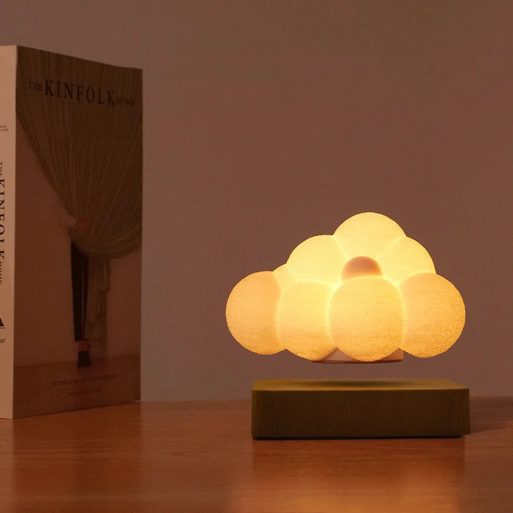 Magnetic levitation cloud lamp with 3D-printed floating cloud and touch control base in warm colour