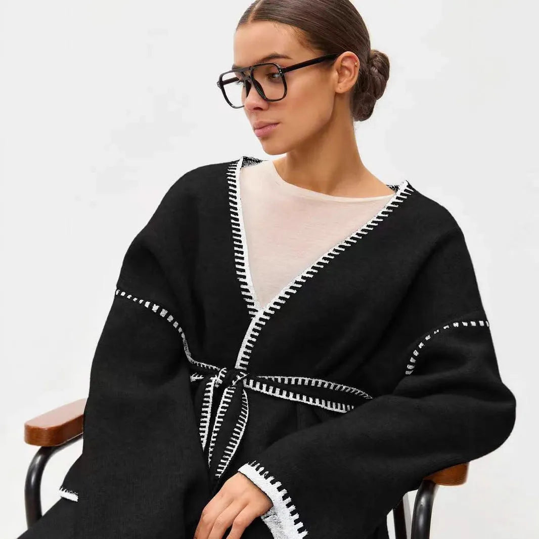 Loose fit knitted cardigan with lace-up sleeves in camel colour showing mid-length design