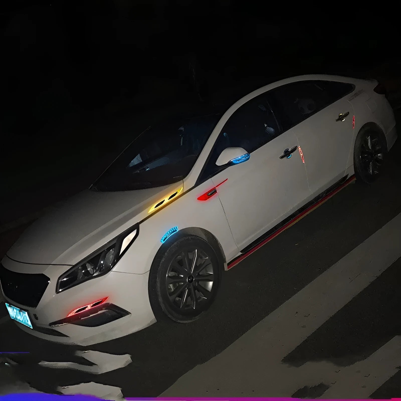 Blue and yellow reflective resin strips for car bumper and wheel arch protection.