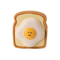 Cartoon pattern latex dog chew toy shaped like egg bread with squeaker in yellow or green