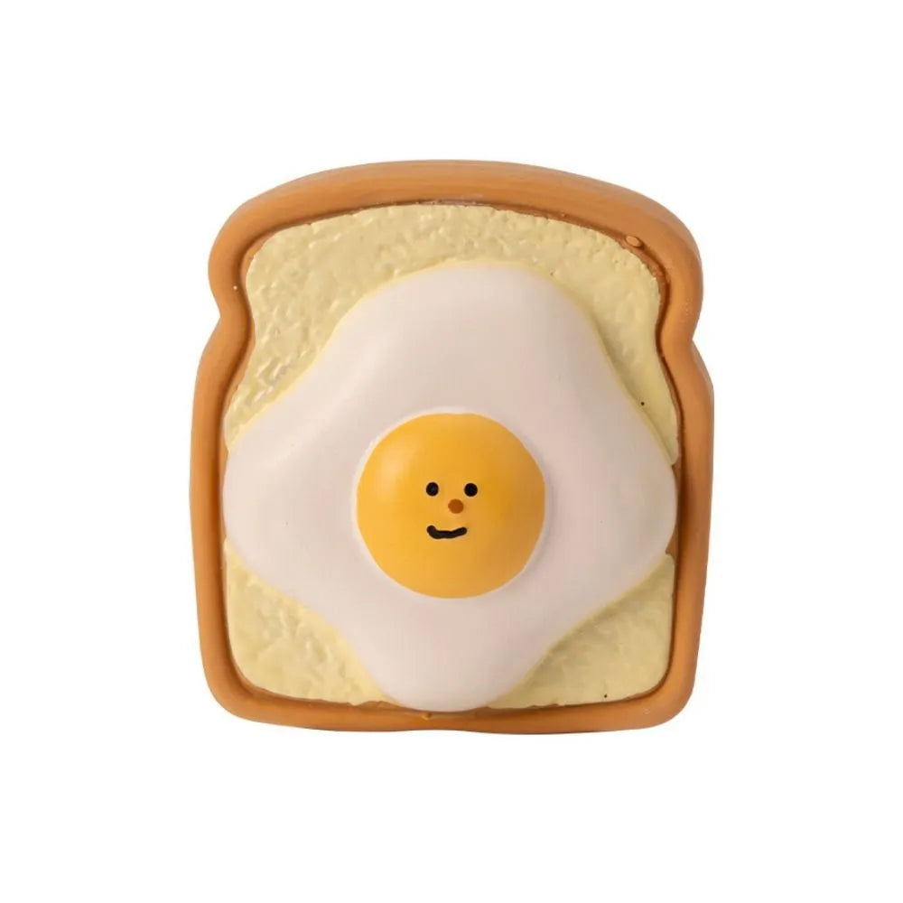 Cartoon pattern latex dog chew toy shaped like egg bread with squeaker in yellow or green