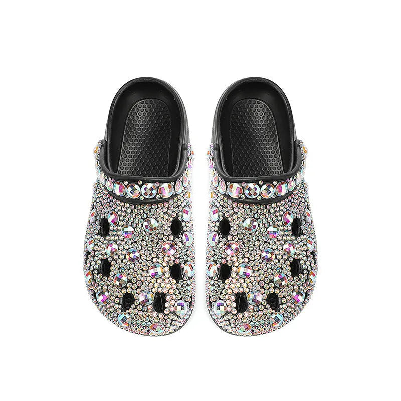 Black women's platform sandals with a perforated design and rhinestone details on the EVA upper.