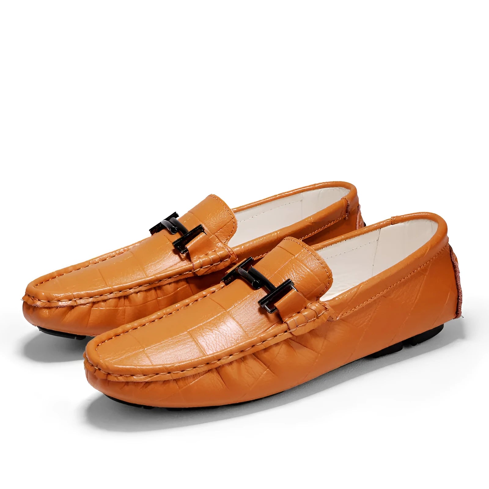 Men's black leather casual pea shoes with a silver belt buckle and flat rubber sole.