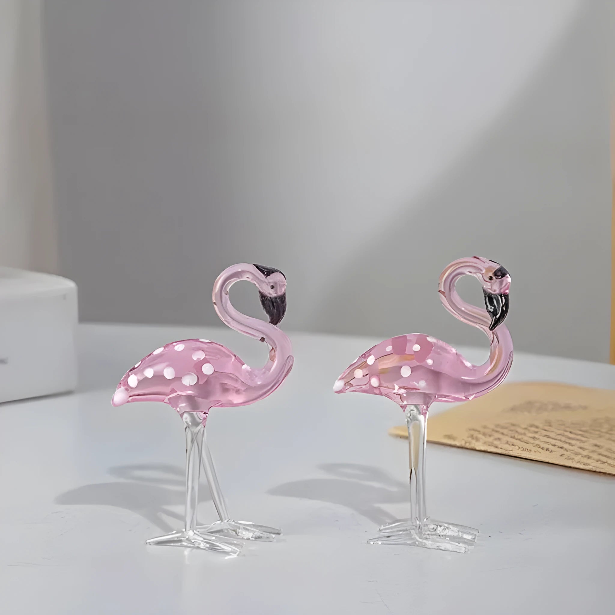 Pink crystal flamingo decorative ornament on table with modern minimalist style
