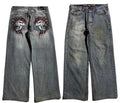 Men's grey washed-out wide-leg straight-cut jeans on a neutral background.