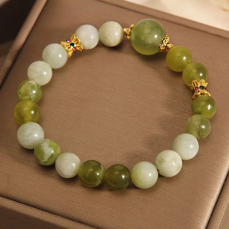 Women's bracelet made of green Xiuyan jade with an original sweet Mori style design.