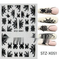 Sheet of nail art stickers with black and silver stripes and a cartoon love heart pattern.