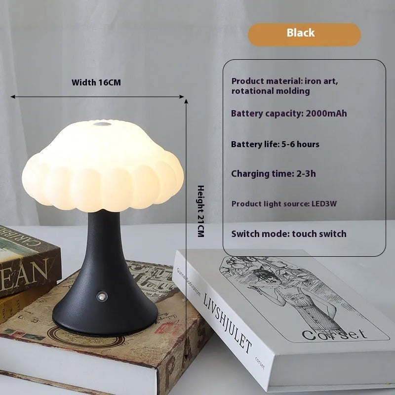 Small mushroom-shaped touch night lamp in wood grain colour on a table.
