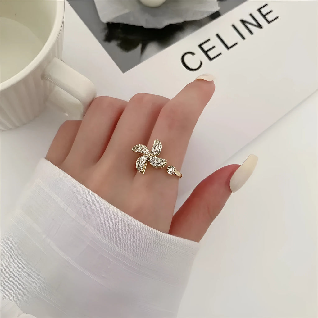 Copper spinning windmill ring with rotating geometric design in gold or silver electroplated finish